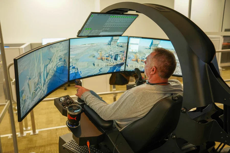Individual operating a water-gun remotely in an Emperor for potash mining 