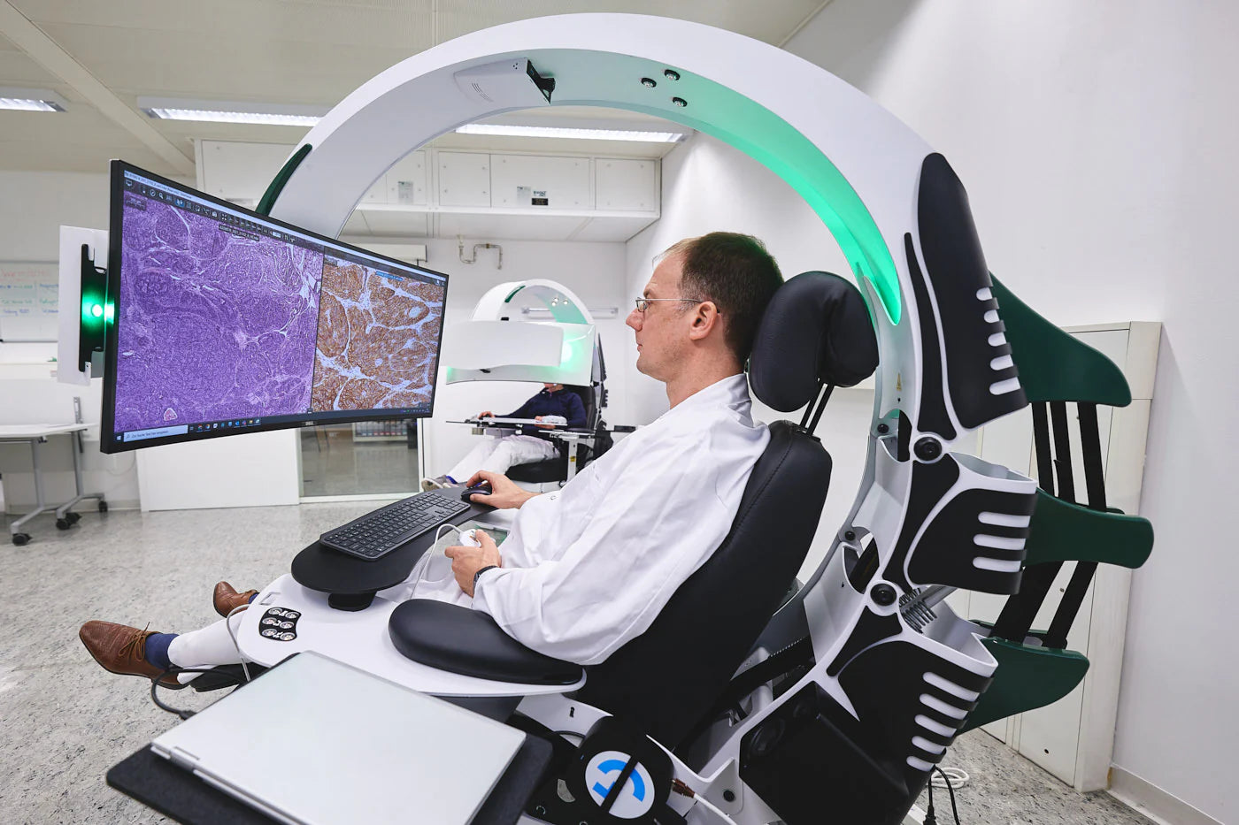 A pathologist reading and scanning images in the Emperor Pathojet workstation